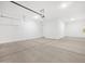 Spacious two car garage with ample room for storage and a door to the house at 17561 W Pierson St, Goodyear, AZ 85395