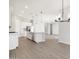 Bright kitchen featuring stainless steel appliances, a large island, and tile flooring at 17561 W Pierson St, Goodyear, AZ 85395