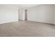 Open-concept space with tile flooring and ample natural light, ready for personalized touches at 17561 W Pierson St, Goodyear, AZ 85395