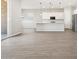 Spacious living room with tile flooring, connecting the kitchen and patio through sliding glass doors at 17561 W Pierson St, Goodyear, AZ 85395