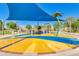 Fun splash pad featuring colorful surfaces, water features, and shade structure at 196 W Yellow Wood Ave, San Tan Valley, AZ 85140