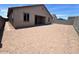 A spacious backyard featuring a blank canvas for a new owner to customize the outdoor space at 2945 S 232Nd Dr, Buckeye, AZ 85326