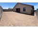 A spacious backyard featuring a blank canvas for a new owner to customize the outdoor space at 2945 S 232Nd Dr, Buckeye, AZ 85326