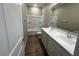 Bathroom featuring double sinks and a shower-tub combo with white tiling at 2945 S 232Nd Dr, Buckeye, AZ 85326