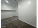 Walk-in closet with ample shelving and soft carpeting, perfect for organized storage at 2945 S 232Nd Dr, Buckeye, AZ 85326
