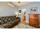 Bedroom featuring a comfortable futon and stylish furniture, ideal for a guest room or additional living space at 41814 N Crooked Stick Rd, Anthem, AZ 85086