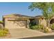 Charming home with a two-car garage, landscaped yard, and inviting curb appeal at 41814 N Crooked Stick Rd, Anthem, AZ 85086