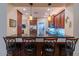 Kitchen featuring bar seating and pendant lighting, providing a stylish and comfortable dining experience at 41814 N Crooked Stick Rd, Anthem, AZ 85086