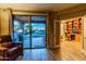 Comfortable living room with sliding glass doors leading to the backyard pool and patio at 41814 N Crooked Stick Rd, Anthem, AZ 85086