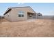 Back of house, view of unlandscaped backyard featuring a covered patio at 4348 W Hannah St, San Tan Valley, AZ 85144