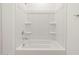 Bright all white shower tub combo in the bathroom at 4348 W Hannah St, San Tan Valley, AZ 85144