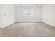 Bright bedroom featuring tile floors, neutral paint and a window at 4348 W Hannah St, San Tan Valley, AZ 85144