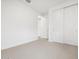 Bright bedroom features neutral carpet and closet with sliding doors at 4348 W Hannah St, San Tan Valley, AZ 85144