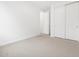 Bright bedroom features neutral carpet and closet with sliding doors at 4348 W Hannah St, San Tan Valley, AZ 85144