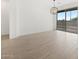 This dining area offers backyard access through glass sliding doors and features modern flooring at 4348 W Hannah St, San Tan Valley, AZ 85144