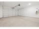Spacious garage with large garage door and utility hookups at 4348 W Hannah St, San Tan Valley, AZ 85144