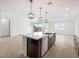Open concept kitchen with an island, stainless steel appliances and a tile floor at 4348 W Hannah St, San Tan Valley, AZ 85144
