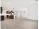 Bright kitchen with stainless steel appliances, a white island, granite countertops and designer pendant lights at 4348 W Hannah St, San Tan Valley, AZ 85144