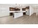 Open concept kitchen featuring tile floors, an island, and stainless steel appliances at 4348 W Hannah St, San Tan Valley, AZ 85144
