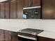 Modern kitchen showcasing stainless steel appliances, a gas cooktop, and white subway tiles at 4348 W Hannah St, San Tan Valley, AZ 85144