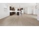 Open-concept living area with stainless steel appliances, granite counters, and a large pantry at 4348 W Hannah St, San Tan Valley, AZ 85144