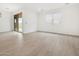 This bright living room boasts tiled floors, a large window with blinds, and a glass sliding door to the backyard at 4348 W Hannah St, San Tan Valley, AZ 85144