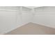 Walk-in closet featuring carpeted flooring and built-in shelving for ample storage at 4348 W Hannah St, San Tan Valley, AZ 85144