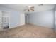 Spacious carpeted bedroom with natural light from a dual window at 11501 W Charter Oak Rd, El Mirage, AZ 85335