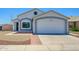 Charming single-Gathering home featuring a two-car garage, low maintenance front yard and neutral color palette at 11501 W Charter Oak Rd, El Mirage, AZ 85335