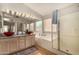 Beautiful bathroom with tub, glass enclosed shower and double sinks at 1631 E Carla Vista Dr, Chandler, AZ 85225