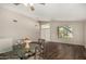 Light and bright dining area features wood flooring and a stylish glass table with seating for four at 1631 E Carla Vista Dr, Chandler, AZ 85225