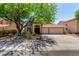 Charming single-Gathering home showcasing a large shade tree and a wide driveway with a 3-car garage at 1631 E Carla Vista Dr, Chandler, AZ 85225