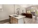 Kitchen island features a granite countertop with a stainless steel sink and lots of workspace at 1631 E Carla Vista Dr, Chandler, AZ 85225