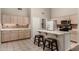 Bright open kitchen features an eat-in island with granite countertops and barstool seating at 1631 E Carla Vista Dr, Chandler, AZ 85225