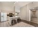 Bright open kitchen features an eat-in island with granite countertops and barstool seating at 1631 E Carla Vista Dr, Chandler, AZ 85225