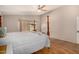 Bright main bedroom featuring wood floors and a ceiling fan at 1631 E Carla Vista Dr, Chandler, AZ 85225