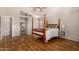 Bright main bedroom featuring wood floors, neutral paint and ensuite bath at 1631 E Carla Vista Dr, Chandler, AZ 85225