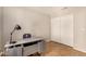 Office space with stylish desk, tile floors, and a large closet at 1631 E Carla Vista Dr, Chandler, AZ 85225