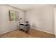 Office space with stylish desk, tile floors, and bright natural light at 1631 E Carla Vista Dr, Chandler, AZ 85225