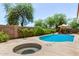 Backyard view of the beautiful pool, spa and patio area with mature landscaping and privacy wall at 1631 E Carla Vista Dr, Chandler, AZ 85225