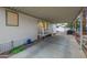 Covered carport offering parking with direct access to the home's entrance at 201 S Greenfield Rd # 51, Mesa, AZ 85206