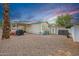 Exterior view of home with a shed, carport, and low-maintenance desert landscaping at 201 S Greenfield Rd # 51, Mesa, AZ 85206