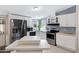 Kitchen with white cabinets, stainless steel appliances, and great lighting at 201 S Greenfield Rd # 51, Mesa, AZ 85206