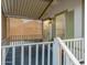 Covered porch with white railings and a screen, perfect for relaxation at 201 S Greenfield Rd # 51, Mesa, AZ 85206