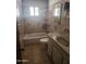 Functional bathroom features a sink vanity, toilet, and a bathtub with tile surround at 3820 W Encanto Blvd, Phoenix, AZ 85009