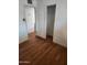 Simple bedroom features two doorways, a closet, and vinyl flooring at 3820 W Encanto Blvd, Phoenix, AZ 85009