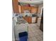 Kitchen features ample cabinet space, white appliances, and tile flooring at 3820 W Encanto Blvd, Phoenix, AZ 85009