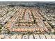 Expansive aerial shot of a sprawling residential community with private pools at 4529 E Thistle Landing Dr, Phoenix, AZ 85044