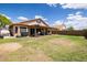 Large backyard showcasing a well-maintained lawn and a covered patio for entertaining at 4529 E Thistle Landing Dr, Phoenix, AZ 85044