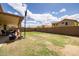 Expansive backyard with a basketball hoop and lush green grass, ideal for recreation at 4529 E Thistle Landing Dr, Phoenix, AZ 85044